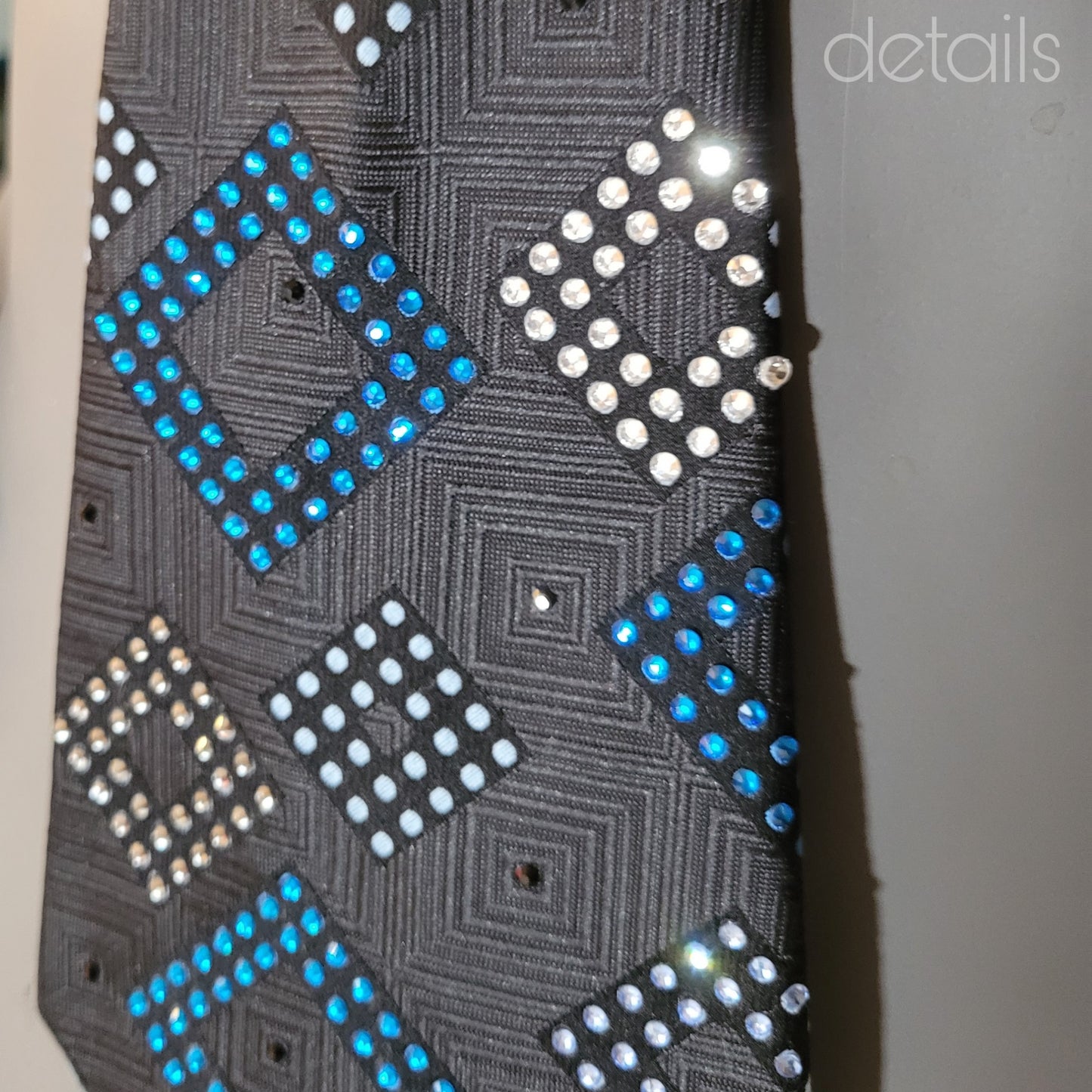 Another Dance collection: Empire State of Mind tie, original 70's retro woven black polyester necktie with geometrical pattern in shades of blue and shimmering glass crystals in matching colours