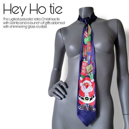 Another Dance collection: Hey Ho tie, maybe the ugliest Christmas tie ever seen, dark marine blue polyester necktie with Santa Claus holding a bunch of gifts adorned with shimmering glass crystals