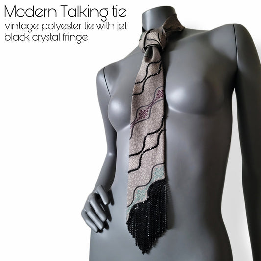 Modern talking tie, vintage polyester tie with a wave almost dna string pattern and black glass crystal fringe