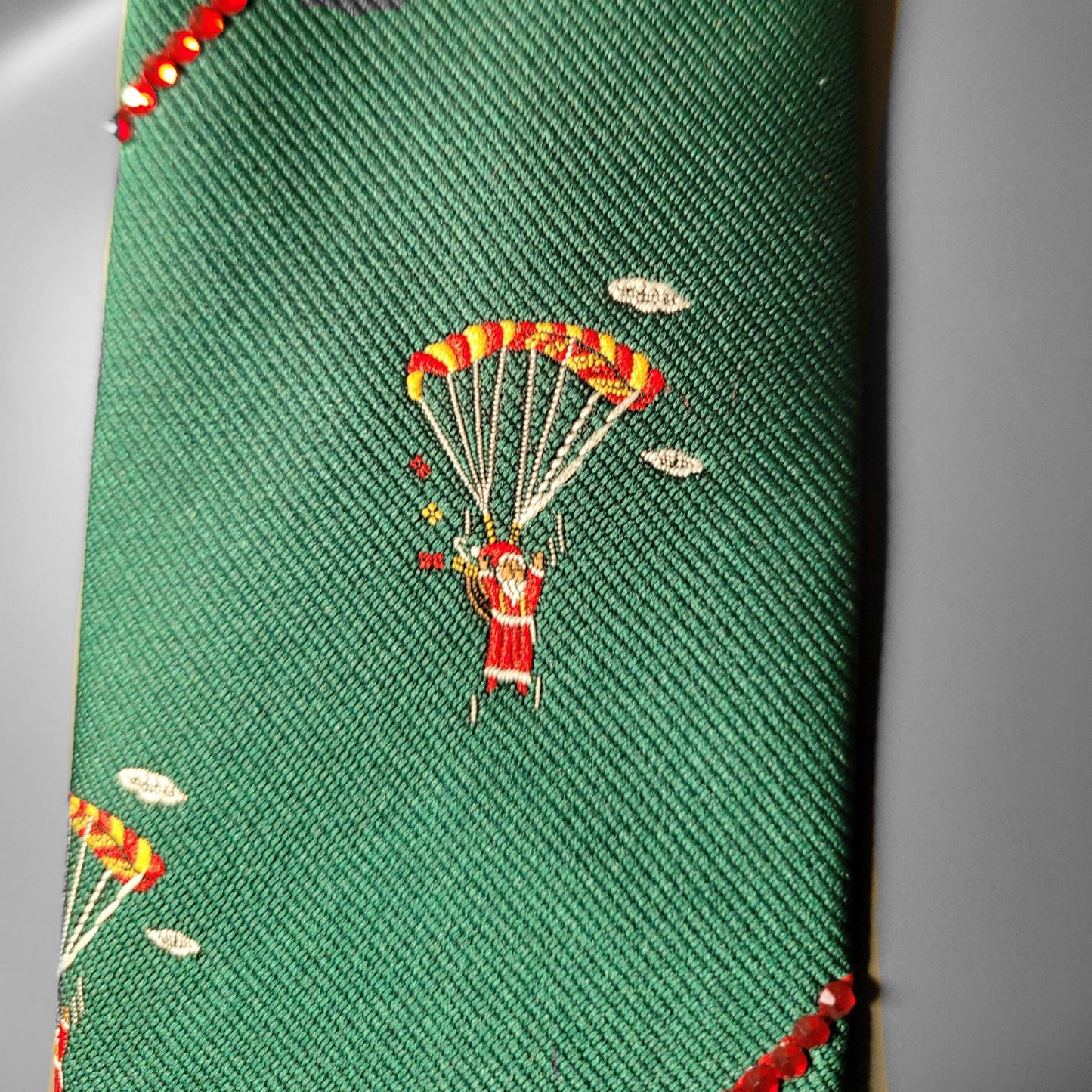 Another Dance collection: Santa Is Coming To Town tie, vintage green Christmas polyester necktie with Santa jumping with a parachute and red glass crystals