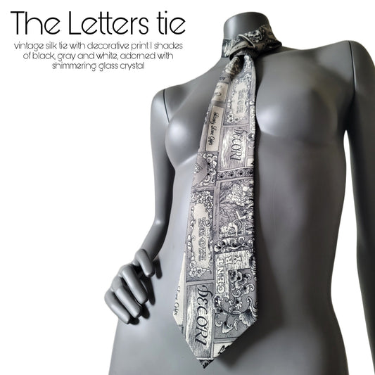 Another Dance collection: The Letters tie, vintage silk necktie with literature inspired print in black, white, and gray, adorned with shimmering glass crystals in shades of black, silver and clear crystal